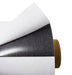 A rolled up self-adhesive ferro-based sheet, predominantly white in color with a black adhesive side.