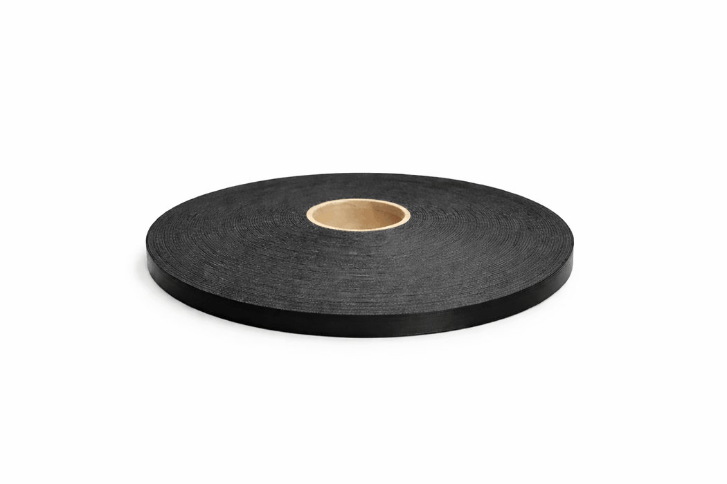 Roll of black glazing foam tape on a white background