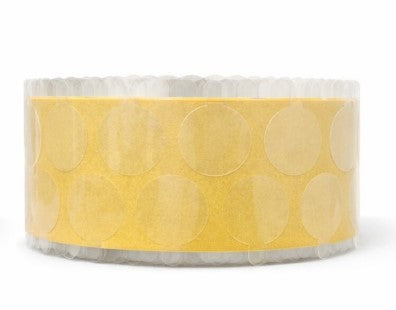 Roll of clear permenant adhesive circle tabs on a roll