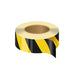 A roll of self-adhesive hazard tape with black and yellow stripes.